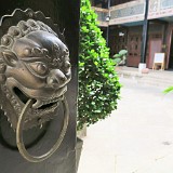 Welcome to Linden Centre  The dragon is the classic protector of houses and temples in China. Here, it protects the entrance to Linden Centre, one of the most luxurious hotels in Yunnan, placed in a beautiful ancient building in Xizhou village.